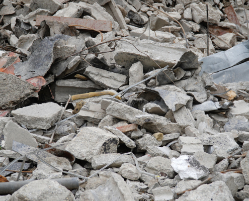 Concrete rubble debris from dump box on construction site, the last remains of an abandoned pavilion