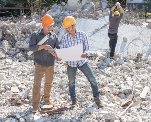 Engineer architect and worker operation control demolish old building