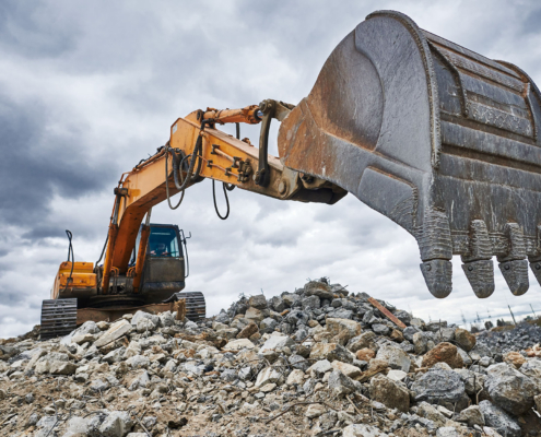 Excavator loader machine at demolition construction site